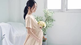 Pregnant Asian woman concept. Maternity photography.