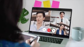 Asian business woman talking to colleague team about plan in video conference. Group of Asian team using laptop for online meeting in video call conference. Smart working from home.