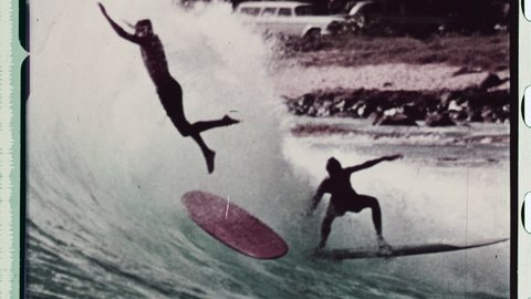 1970s Gold Coast QLD, Australia. Montage of Surfers crashing on Waves. Surf Board riders Fail, Fall, and Crash on big wave. 4K Overscan of Vintage Archival 35mm Film Print