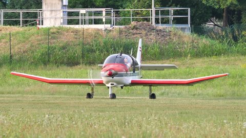 Thiene, Italy JULY, 8, 2021 Propeller plane Robin DR400 waits on the runway with the engine on for the glider to be towed in flight