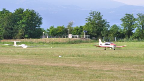 Thiene, Italy JULY, 8, 2021 Takeoff of an airplane towing a glider. Robin DR400 OE-DFS
