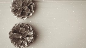 Animation of snow falling over christmas decorations. christmas, tradition and celebration concept digitally generated video.