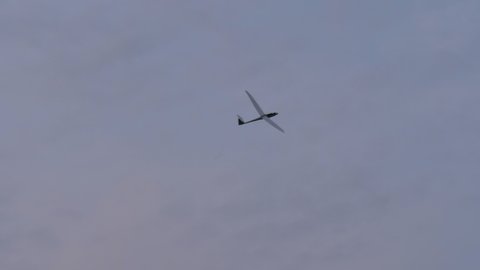 Thiene, Italy JULY, 8, 2021 High performance glider with very advanced aerodynamics in flight in the blue sky. Schempp-Hirth Duo Discus