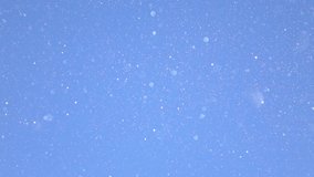 SLOW MOTION, CLOSE UP, DOF: Scenic shot of the glittering diamond dust on sunny winter day. Tiny specks of diamond dust shimmer in the bright winter sunshine. Frozen snowflakes fall from the blue sky. - Powered by Shutterstock - Get 15% off with code: PIKWIZARD15