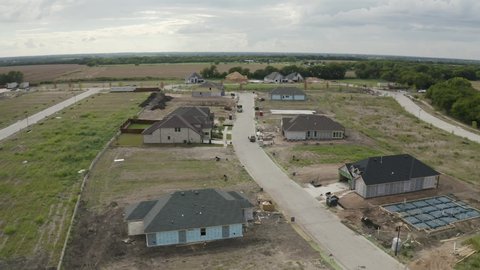 revealing overhead view of real estate boom town - sprawling neighborhood development Dallas community in North Texas - 4K Drone