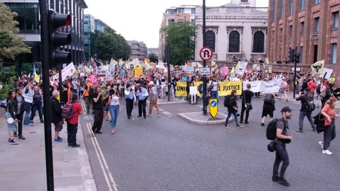 LONDON, UK – August 28, 2021: Crowds of Extinction Rebellion Animal Rights Activists March through London, England, UK