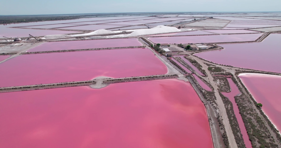 Majestic purple color lakes and salt mines in Camargue, France. High angle drone view