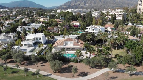 Luxurious Wealthy Neighborhood, Beautiful Homes in Marbella, Spain. Aerial Pan Out View