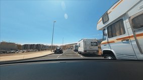 Time-lapse video of driving in desert hot summer landscape. Car drive on highway in beautiful scenery. Sandy rocks, blue skyline. Concept for roadtrip.