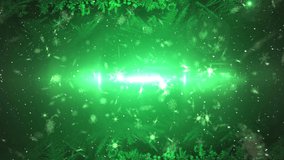 Animation of snow falling and glowing lights on green background. christmas, tradition and celebration concept digitally generated video.