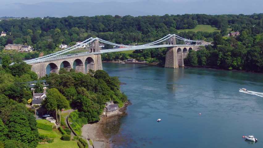 Aerial of the Menai Suspension Bridge, Anglesey, North Wales, United Kingdom Royalty-Free Stock Footage #1078364570