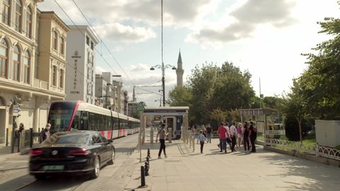 ISTANBUL, TURKEY - SEPTEMBER 23rd 2020: Camera follows modern tram on Divan Yolu street, Istanbul
