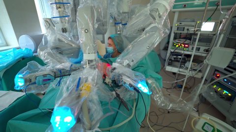 Medical robot in modern operating room. Surgical operation with robotic system. Cancer removal surgery via minimally invasive robotic surgery. Hi-tech medical robot.