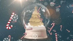 Animation of snow and candy canes falling over christmas snow globe with christmas tree decoration. christmas, tradition and celebration concept digitally generated video. - Powered by Shutterstock - Get 15% off with code: PIKWIZARD15
