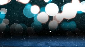 Animation of snow falling over glowing spots of light with copy space and wooden surface. christmas, tradition and celebration concept digitally generated video.