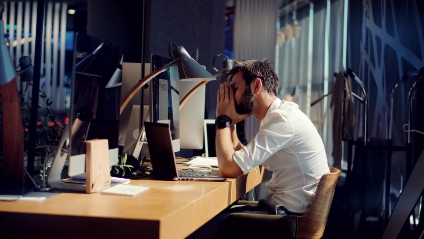 Tired Worker Overworked On Computer.Frustrated Businessman Working Alone.Office Work Overtime. Workaholic Work In Internet Deadline.Tired Businessman In Night Office.Overwhelmed Exhausted Stressed Man | Shutterstock HD Video #1078382666