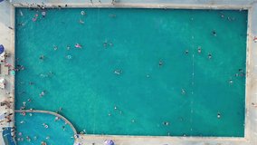 Aerial video of swimming on vacation