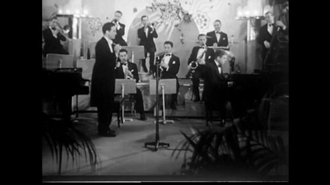 CIRCA 1940s - The Three Canadian Capers begin to sing "A Little Robin Told Me So," with a full orchestra backing them at a nightclub.