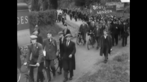 CIRCA 1932 - The National Hunger March makes its way to London's Hyde Park, where participants receive soup.