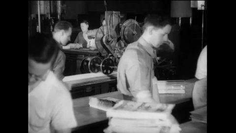 CIRCA 1937 - Issues of Life Magazine are stacked by machine, then packaged for distrubtion by hand.