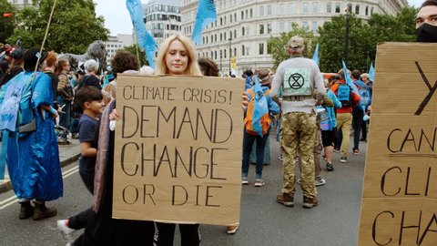 LONDON, circa 2021 - Extinction Rebellion supporters gather around Trafalgar Square, London, during a 2-week demonstration against Climate Change, under the name "The Impossible Rebellion"