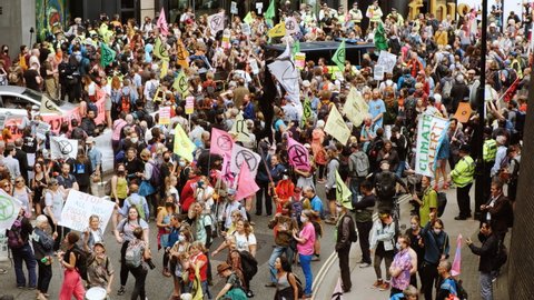 LONDON, circa 2021 - Extinction Rebellion supporters gather around the City of London, during a 2-week demonstration against Climate Change, under the name "The Impossible Rebellion"