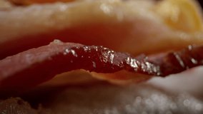 Composition of juicy sausages and appetizing bacon, smooth departure. Macro frame of foodstyle for advertising video. laowa lens. High quality 4k footage
