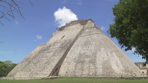 UXMAL, MEXICO - CIRCA 2021: Pyramid of the Magician, a step pyramid in ancient Mayan city of Uxmal, Yucatan