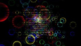 4K video of the abstract dark colorful background with random moving colorful bubble texture in space. Energy force fields with thousands of colorful bubbles moving in black background.
