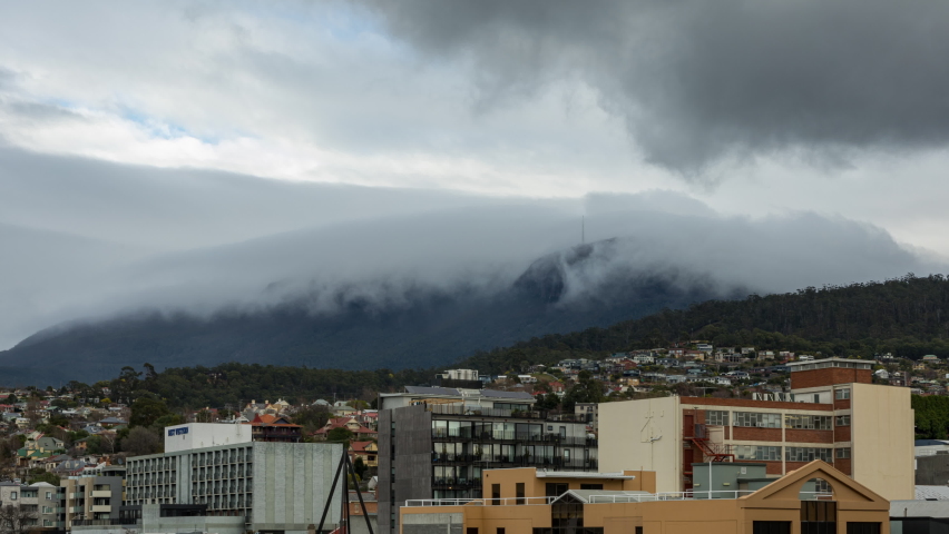 Roll clouds forming and decaying in time lapse over Mt Wellington range in the background of Hobart (Tasmania)
