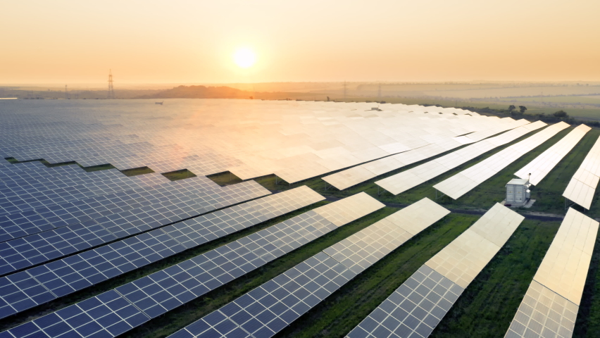 Aerial view of Solar Power Station Panels. Fields Green Energy at Sunset. Landscape electrical power ecology innovation nature environment. Ecology, Electrical Innovation, Environment. | Shutterstock HD Video #1078412129