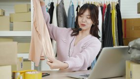 business online,POV Asian woman influencer seller broadcast live streaming to sell clothes for online social marketing
