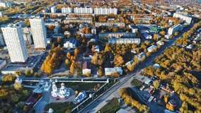 Aerial video of autumn city and Church of the Archangel Michael. Novosibirsk, Siberia, Russia