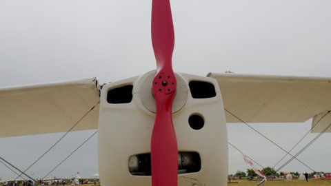 Screw aircraft. Retro plane. Retro airplane propeller. close-up of slowly working propeller. exhibition fair of retro planes.