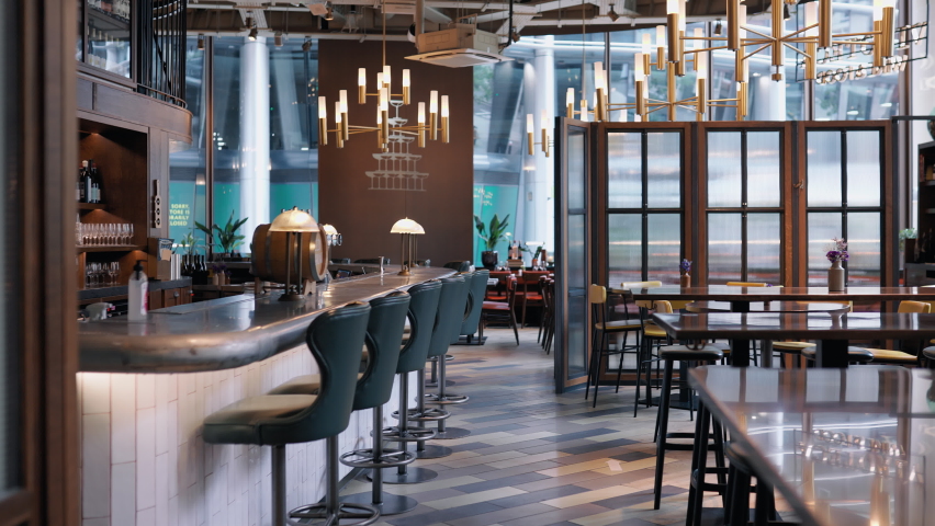 Panning shot of bar and restaurant tables | Shutterstock HD Video #1078421246
