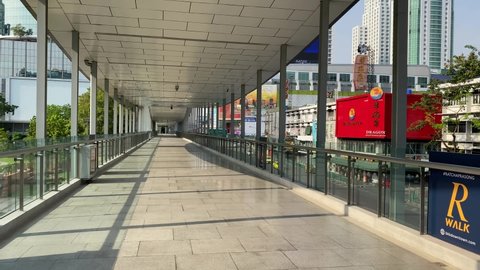 Bangkok, Thailand - April 29, 2021: An empty CentralWorld Skywalk and Ratchaprasong Skywalk in Bangkok. This skywalk connects Pratunam and centralworld but is empty because of the covid 19 restriction