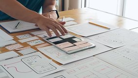 UX or UI designer designing application on tablet with mockup layout prototype. - Powered by Shutterstock - Get 15% off with code: PIKWIZARD15