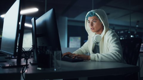 Late at Night in Office: Portrait of Young Stylish Freelancer Woman Working on Desktop Computer. Non-Binary Person Creating Modern Content, Do Contemporary Project Design, Create Colorful Marketing
