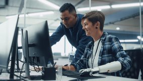 Teamwork In Diverse Office: Smiling Project Manager Talks with Woman with Disability Using Prosthetic Arm to Working on Desktop Computer. Professionals Create e-Commerce Software App Solution - Powered by Shutterstock - Get 15% off with code: PIKWIZARD15