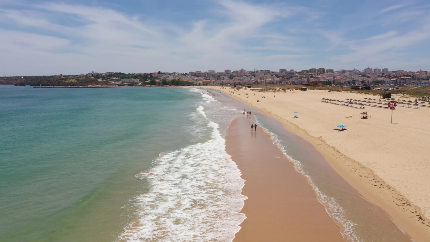 Flying over long beaches towards Lagos town, as Covid-19 lockdown restrictions are eased and Portugal opens borders to tourists (Europe Summer holiday)
 Royalty-Free Stock Footage #1078431482