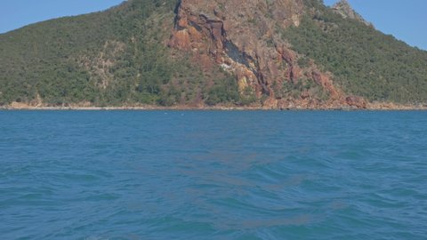 Rocky Peak Of Pentecost Island Against Blue Sky - Scenic Island With Seascape In Whitsunday, QLD, Australia. - tilt up