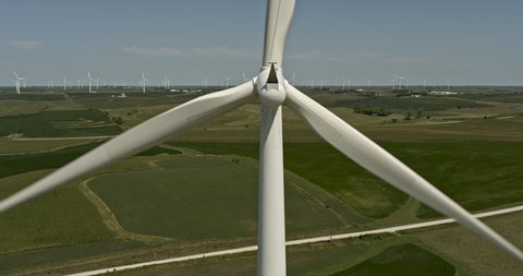 Adair Iowa Dramatic close up aerial of wind turbines generating alternative energy - 6k footage - August 2020