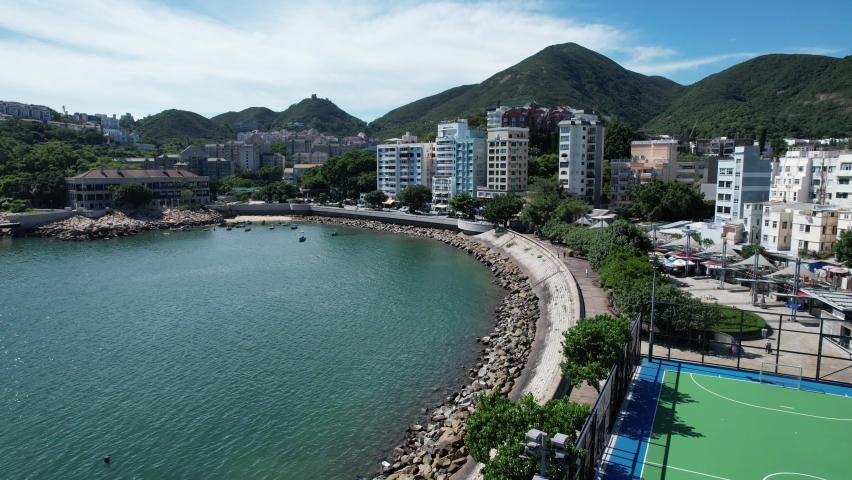 Stanley, a coastal town of Hong Kong, with traditional villages, beautiful scenery, water activities, beaches and islands, sea bay, pier and boats in-shore, aerial view