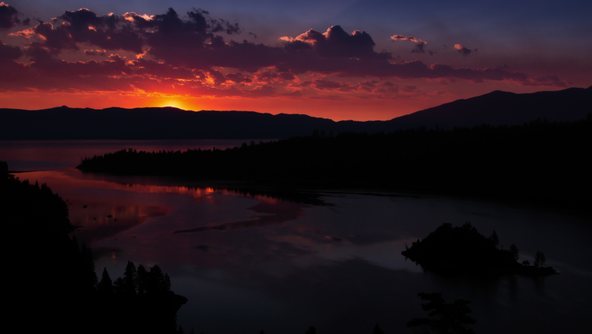 Emerald Bay Sunrise Time Lapse With Smoke from Nearby Wildfire and Paddle Boarders Paddling around Fannette Island in South Lake Tahoe, California, USA Timelapse Time-Lapse