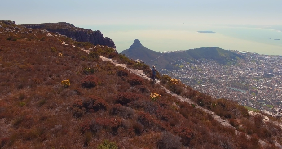 Aerial of Man Walking on Top of Table Mountain, Cape Town, South Africa