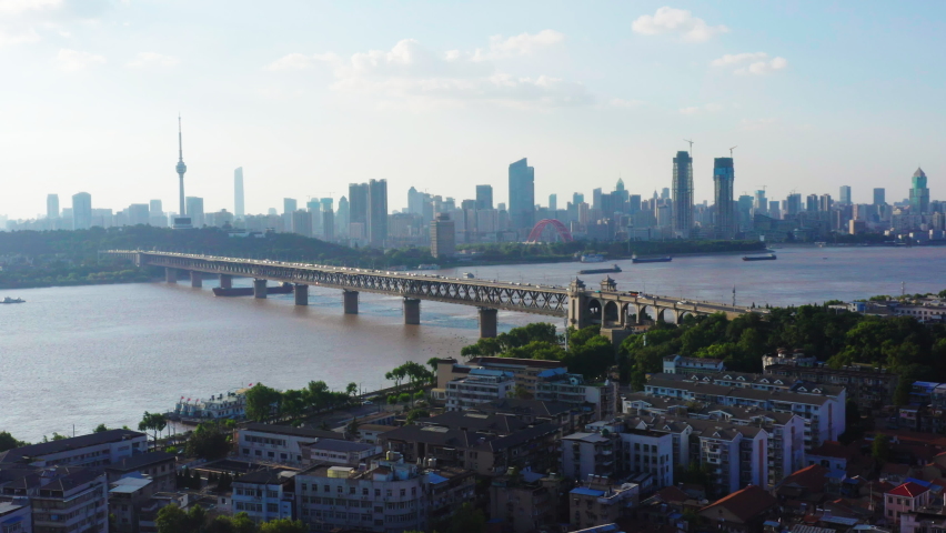 Aerial view of Wuhan skyline and Yangtze river with supertall skyscraper under construction in Wuhan Hubei China. | Shutterstock HD Video #1078473173