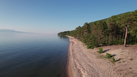 Summer evening aerial landscape of Lake Baikal is a rift lake located in southern Siberia, Russia Baikal lake summer landscape view. Drone's Eye View.