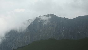 Rocky mountain in a foggy day during summer