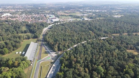 Aerial video of The Autodromo Nazionale of Monza, that is a race track located near the city of Monza, north of Milan, in Italy. Drone footage of the circuit in Monza. Grand prix in September.