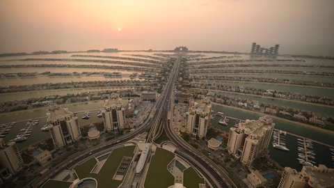 Top views of Palm Jumeirah Island with the iconic Atlantis hotel in the heart of it off the coast of Dubai. Dubai, UAE - July 2021
